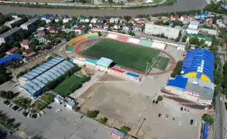 реконструкция стадиона Мунайшы в Атырау новые трибуны залы для спорта футбольное поле с подогревом